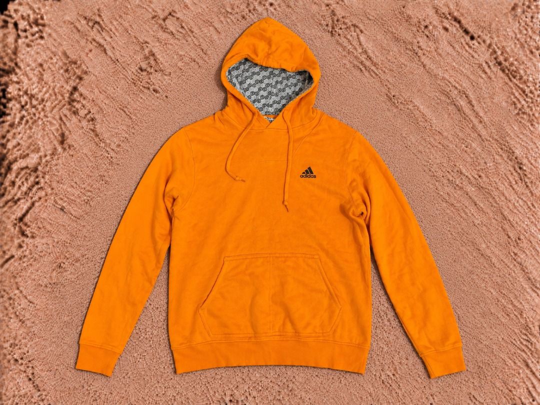 Adidas Orange Hoodie Pullover Size L (Category: Coats, Jackets and Outerwear) located in Quezon City. Submitted by drift_and_vibe_thrift (Listing ID 1463591037, Image 1). Description: - Orange Adidas hoodie - Size L - Features a cool patterned lining inside the hood - Front kangaroo pocket - Great for casual wear.