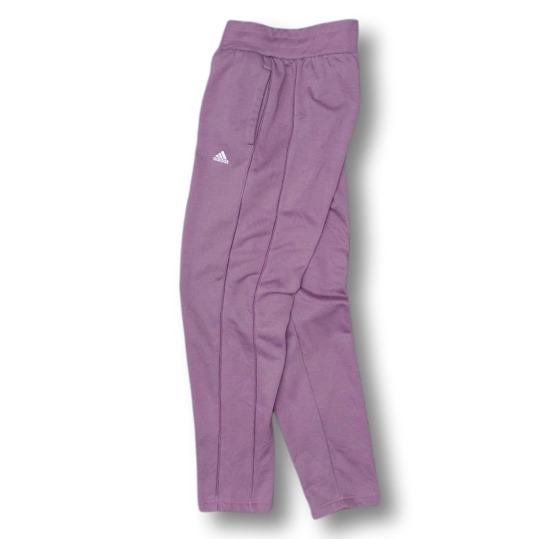 Adidas Purple Jogger Pants (womens) (Category: Joggers) located in Cavite. Submitted by spinfits (Listing ID 1463573146, Image 2). Description: - Purple Adidas joggers - Elastic waistband with drawstring - Two side pockets - Subtle Adidas logo on left leg - Comfortable and casual - Ideal for lounging or light workouts Dimensions (Inches) Size: 28-35 Legth: 39 Thigh: 12 Leg opening: 5.5 Condition: (Like new) Color rate: 10/10 Issues: Missing draws