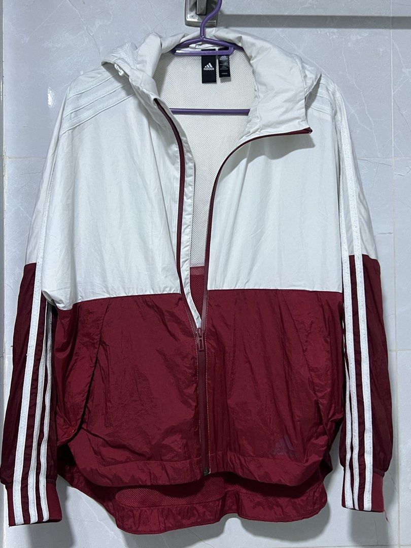 Adidas Windbreaker Jacket White Burgundy (Category: Coats, Jackets and Outerwear) located in Manila. Submitted by jj0451315 (Listing ID 1463632946, Image 3). Description: - Adidas Jacket - Color: White and Burgundy - Classic three stripes on sleeves - Hooded design with full zip closure - Lightweight material, ideal for windy days or light rain - Two side pockets - Versatile for sports or casual wear.