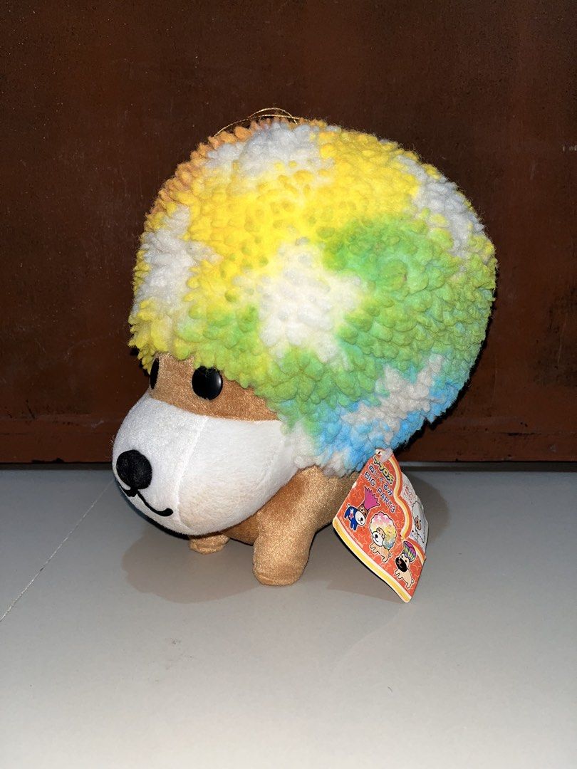 Afro Ken (Category: Plushies & Soft Toys) located in Tarlac. Submitted by ysabellea_ (Listing ID 1463715714, Image 1). Description: - Adorable plush toy featuring a dog with a vibrant tie-dye afro. - Super fluffy and soft texture. - Includes a small gold loop for easy hanging. - Brand new with tag still attached, part of a collection. - Ideal for plush toy collectors or as a fun, unique gift..