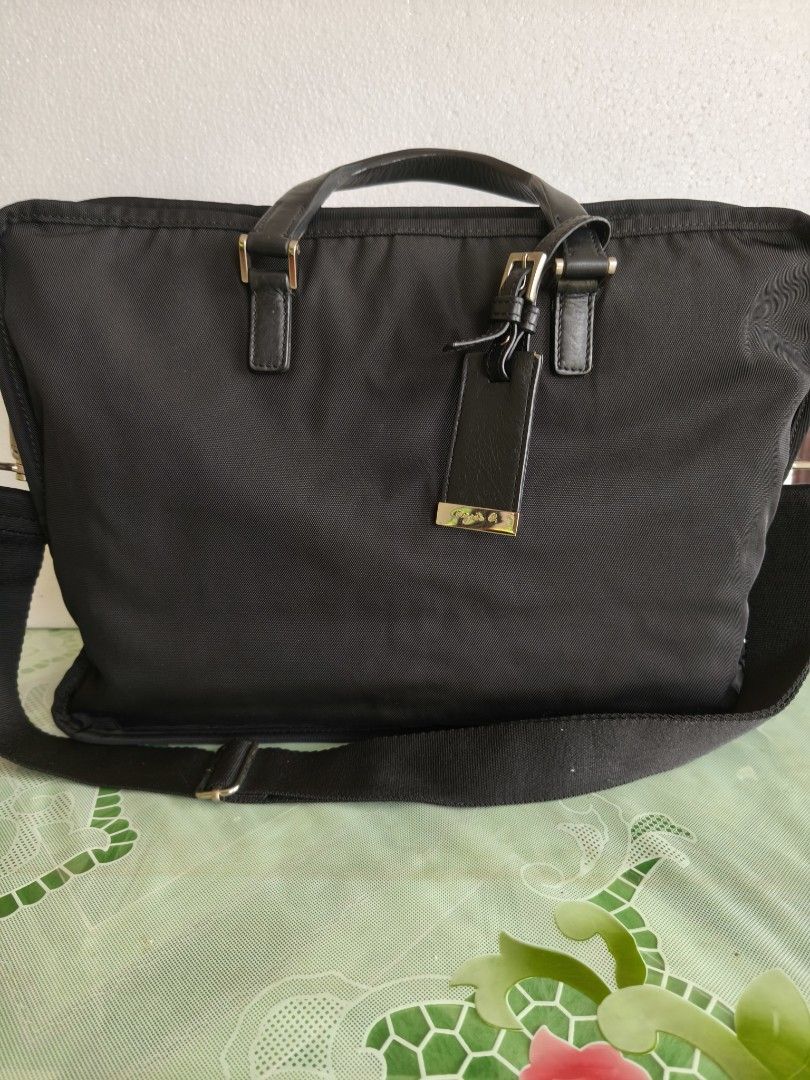 Agnes B (Category: Briefcases) located in San Juan City. Submitted by vingabby (Listing ID 1463576546, Image 1). Description: - Color: Black - Material: Durable nylon with leather accents - Features: Detachable shoulder strap, ample space for laptop and essentials - Ideal for: Work and travel .