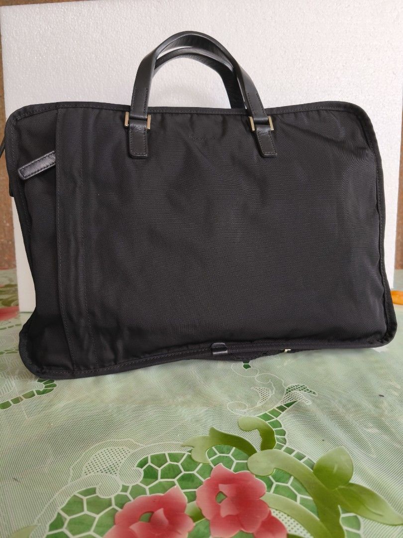 Agnes B (Category: Briefcases) located in San Juan City. Submitted by vingabby (Listing ID 1463576546, Image 2). Description: - Color: Black - Material: Durable nylon with leather accents - Features: Detachable shoulder strap, ample space for laptop and essentials - Ideal for: Work and travel .