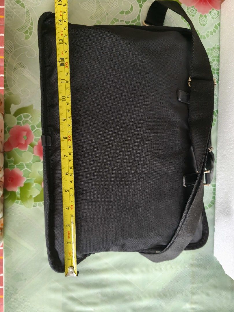 Agnes B (Category: Briefcases) located in San Juan City. Submitted by vingabby (Listing ID 1463576546, Image 3). Description: - Color: Black - Material: Durable nylon with leather accents - Features: Detachable shoulder strap, ample space for laptop and essentials - Ideal for: Work and travel .