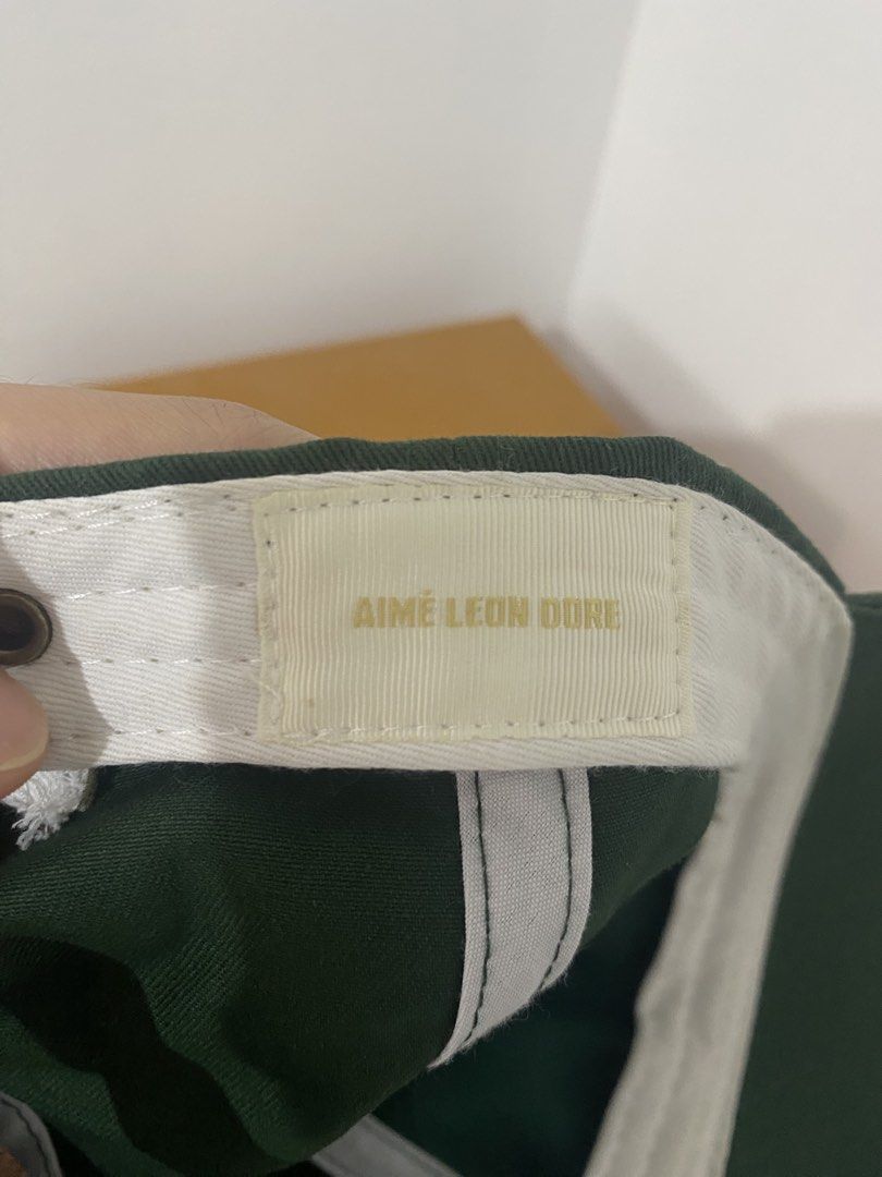 Aimé Leon Dore Green Embroidered Logo Baseball Cap (Category: Caps & Hats) located in Caloocan City. Submitted by NotYetDressed (Listing ID 1463716437, Image 3). Description: - Brand: Aimé Leon Dore - Color: Green - Style: Baseball Cap - Features: Classic embroidered logo on front - Closure: Adjustable leather strap with metal buckle - Ideal for: Everyday wear, stylish and simple.