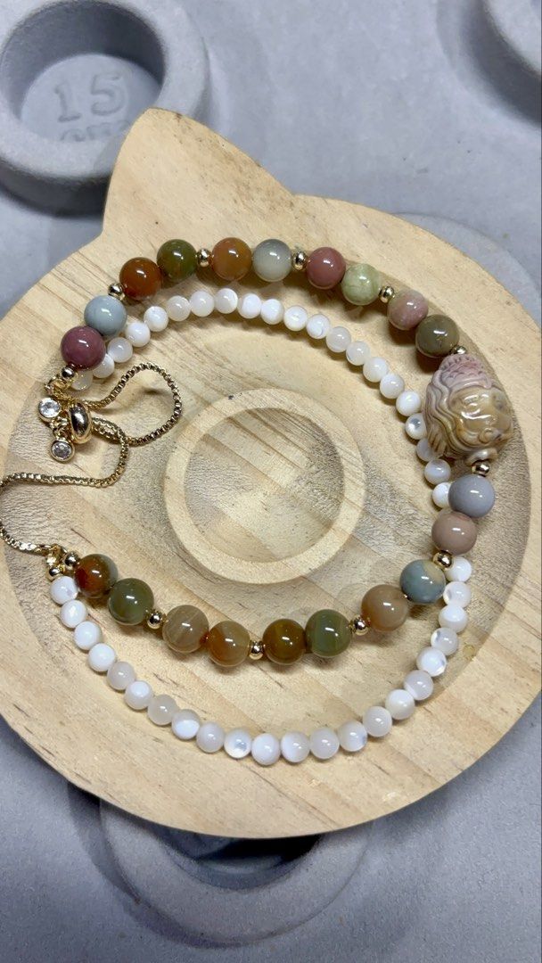 Alashan Mermaid + Sakura Agate Beaded Bracelet (Category: Bracelets) located in Rizal. Submitted by va_nes_sa_ (Listing ID 1463632882, Image 2). Description: - Handmade bracelet featuring Alashan Mermaid and Sakura Agate beads. - Properties: Grounding, inner peace, love, growth, emotional harmony, and transformation. - Accents: White shell beads and gold details. - Design: Adjustable chain with charming accents. - Style: Unique and perfect for ev