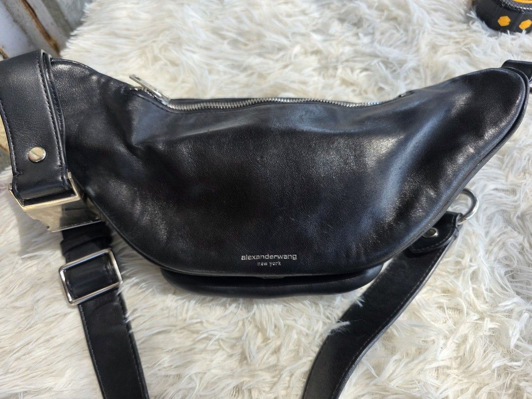 Alexander Wang Black Leather Fanny Pack (Category: Belt bags, Clutches and Pouches) located in Lemery. Submitted by venus23 (Listing ID 1463740354, Image 2). Description: - Alexander Wang black leather fanny pack - Made in China with premium European leather - Multiple zippered compartments for secure storage - Stylish silver chain detail - Adjustable strap for a comfortable fit - Ideal for keeping your essentials easily accessible.