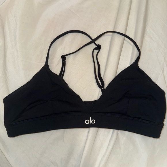 Alo Yoga Splendor Bra (Category: Activewear) located in Quezon City. Submitted by apujooz (Listing ID 1463568257, Image 3). Description: - Black Alo Yoga sports bra - Features thin straps and triangle cups - Elastic band with signature Alo logo - Ideal for workouts and lounging - Provides comfort and excellent support - Fits beautifully.