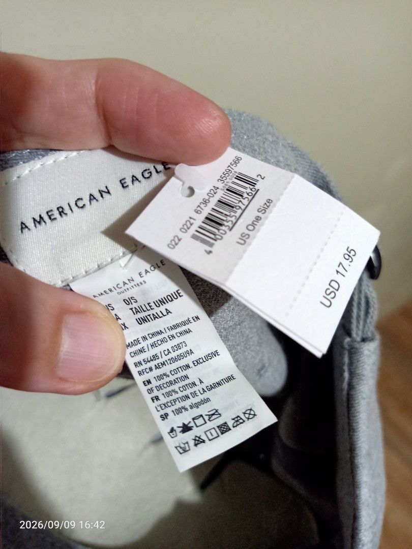 American Eagle Cap/Hat (Category: Caps & Hats) located in Las Pinas. Submitted by OmengSoyT (Listing ID 1463653033, Image 3). Description: - Brand: Authentic American Eagle - Color: Grey - Design: Navy blue embroidered eagle logo on front - Material: 100% Cotton - Size: One Size Fits All - Condition: Brand new with original hang and washed tags attached - Style: Casual wear.
