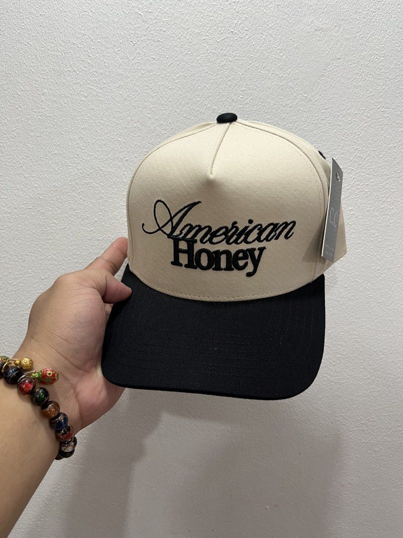 American Honey & Mama Caps - Various Designs (Category: Caps & Hats) located in Mandaluyong City. Submitted by lrperiojr (Listing ID 1463702417, Image 3). Description: - 'American Honey' caps available in orange, red, and black embroidery. - 'MAMA' caps available in black and navy embroidery. - All caps feature a cream crown with a contrasting brim. - Ideal for everyday casual wear. - Please check photos for detailed views of each cap..