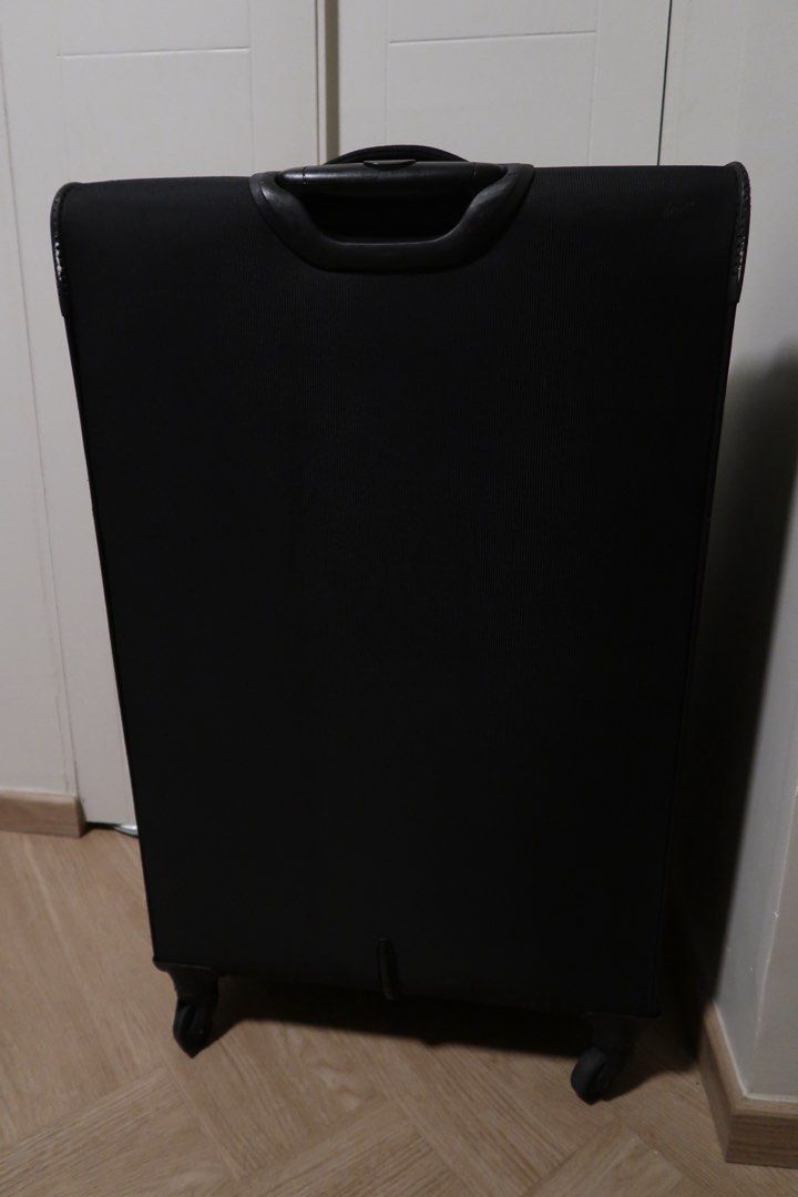 American Tourister Black Soft Shell Luggage Large (Category: Luggage) located in Pasig City. Submitted by dcvirata (Listing ID 1463680657, Image 2). Description: - Large black American Tourister suitcase - Red trim and bright red interior - Smoothly functioning zippers - Issues: wheels need replacement, lock works but it’s not smooth Dimensions: - Length 46cm - Height 78cm - Width 27cm.