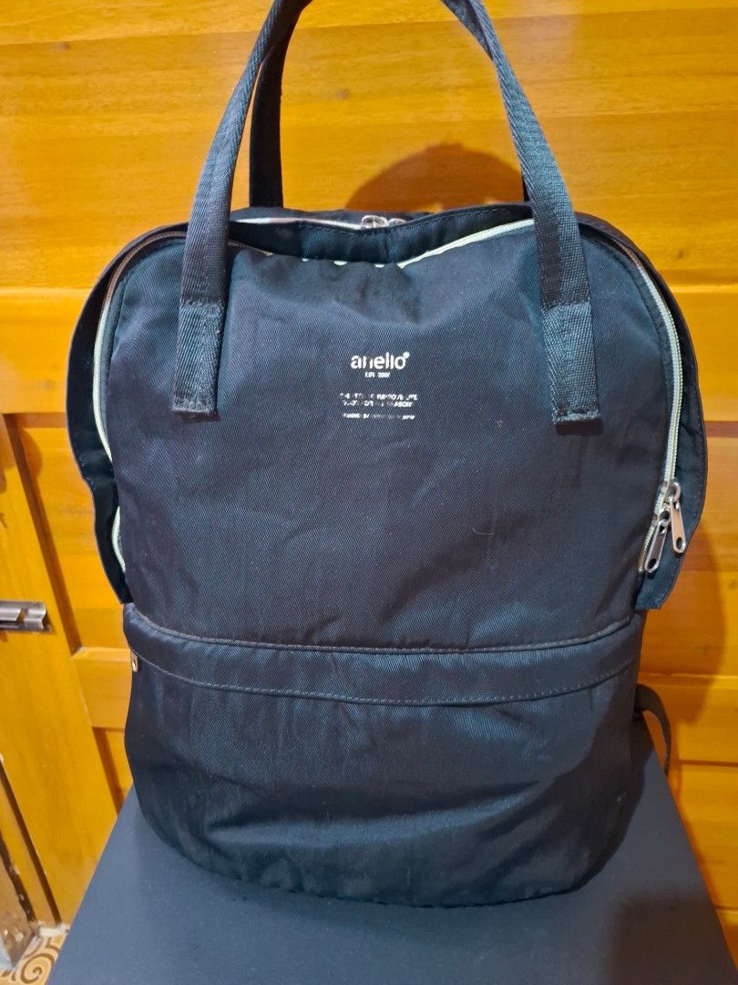 Anello Backpack Black (Category: Backpacks) located in Muntinlupa City. Submitted by googoosh_collection (Listing ID 1463578310, Image 1). Description: *Black Anello backpack with top handles and shoulder straps. Features multiple zipper compartments, including one with an inner mesh pocket. Spacious and perfect for daily use or travel. *RFS: Decluttering MOD: Lalamove (Shipping fee shouldered by the buyer) MOP: Gcash 📍Location: Muntinlupa.