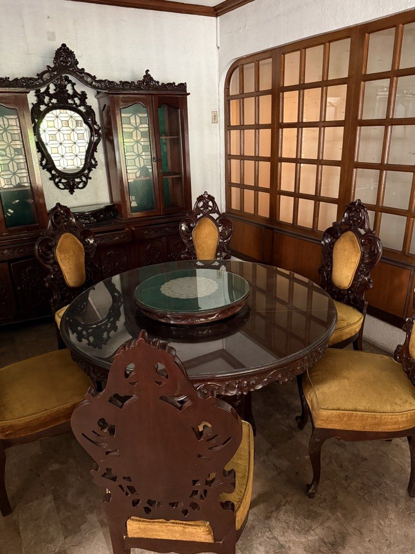 Antique Solid Wood Dining Set | Elegant & Classic (Category: Other Home Furniture) located in Pasay City. Submitted by bodega_veneta (Listing ID 1463597477, Image 3). Description: Antique Solid Wood Dining Set Beautiful antique solid wood dining set with intricate carved detailing and a timeless, elegant design. The rich dark wood and yellow gold upholstery give it a classic yet chic look. Includes round dining table, 6 chairs. Priced low due to 