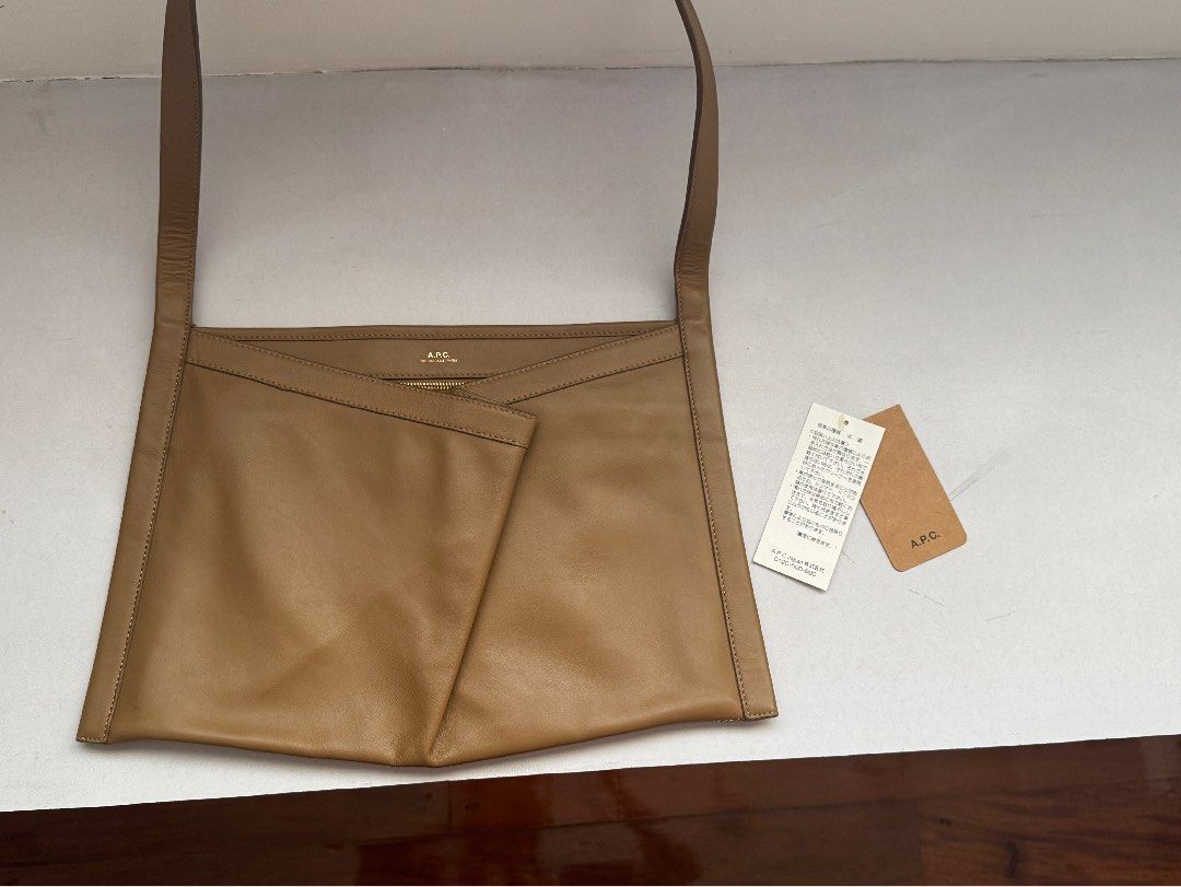 A.P.C. Ada Baguette Bag Tan Leather (Category: Shoulder Bags) located in Manila. Submitted by selenejuli94730 (Listing ID 1463620239, Image 1). Description: - Authentic A.P.C. shoulder bag - Color: Tan - Material: Genuine Leather - Interior: 1 zip pocket, 1 slip pocket - Comes with original tags - Ideal for everyday wear - Bought in Japan - Barely used.