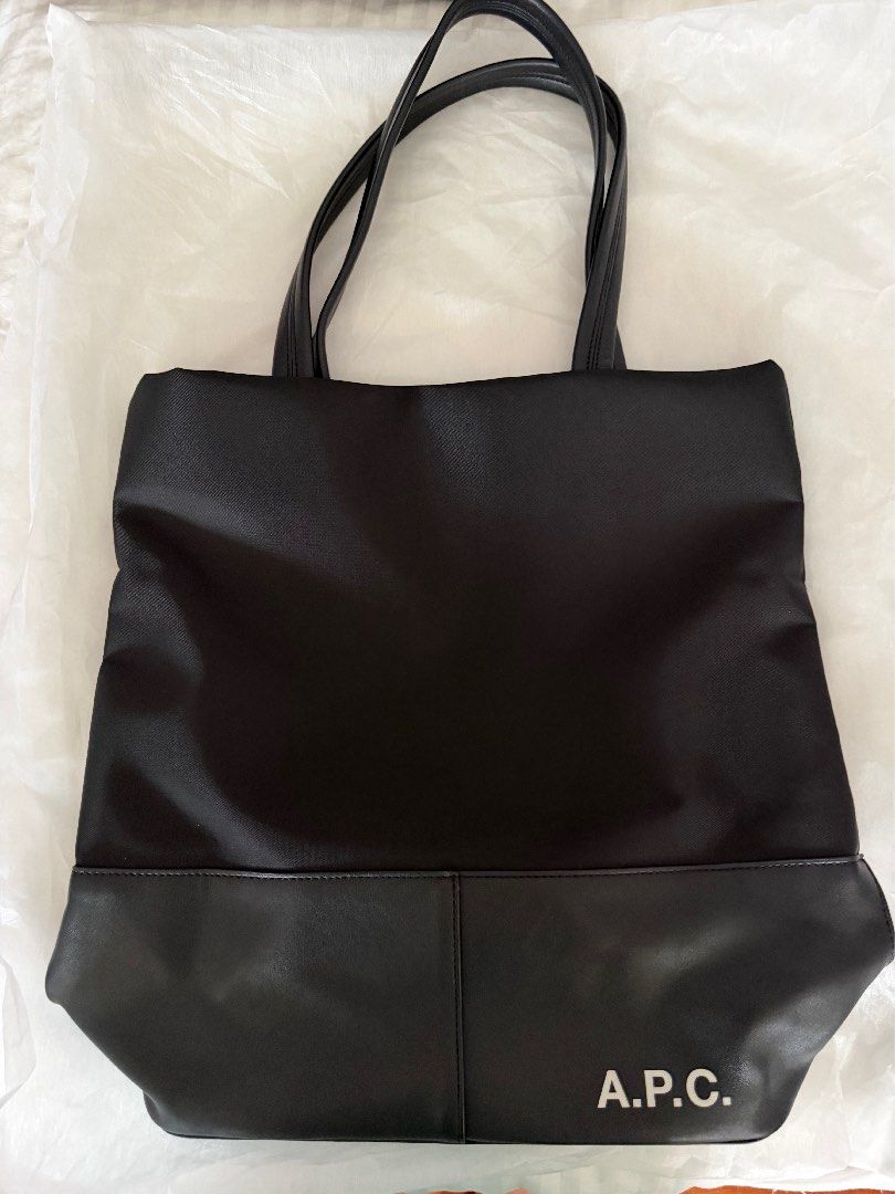 A.P.C. Camden Black Nylon Leather Tote Bag (Category: Tote Bags) located in Quezon City. Submitted by prettyme23 (Listing ID 1463619315, Image 3). Description: - Classic black tote bag from A.P.C. - Made with durable nylon and premium leather details - Simple, functional, and perfect for everyday use - Spacious interior for all your essentials - Subtle A.P.C. logo on the front - Comfortable handles for easy carrying.