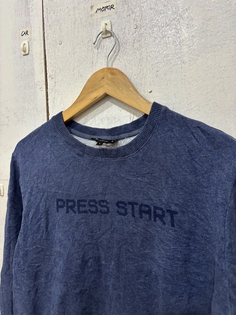 A.P.C. Blue Press Start Crewneck Sweatshirt (Category: Coats, Jackets and Outerwear) located in Manila. Submitted by noribrahim.20 (Listing ID 1463682896, Image 3). Description: - Brand: A.P.C. - Type: Crewneck Sweatshirt - Color: Blue - Size: L - Material: 100% Cotton - Features: Long sleeves, ribbed cuffs and hem, 'PRESS START' text print on chest - Style: Casual wear.