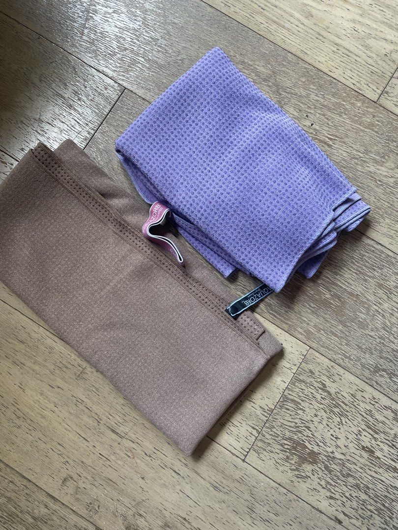 Aquazorb Yoga Towels (Purple & Brown) (Category: Activewear) located in San Juan City. Submitted by gil07 (Listing ID 1463573695, Image 1). Description: - Two Aquazorb yoga towels available. - One vibrant purple towel with a waffle texture. - One neutral brown towel with a subtle textured pattern. - Ideal for hot yoga and intense workouts to absorb sweat. - Lightweight and easy to carry for your practice. - Get both towels for a complete yoga exp