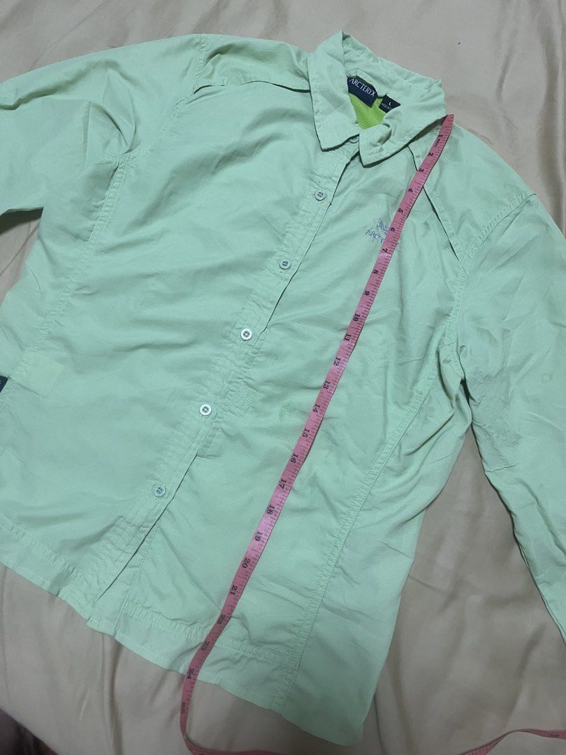 Arc'teryx Lightweight Button-Up Shirt (Category: Coats, Jackets and Outerwear) located in Mandaluyong City. Submitted by hopeworldplane (Listing ID 1461910186, Image 3). Description: - Light green Arc'teryx button-up shirt - Long sleeves with button cuffs - Lightweight material, ideal for outdoor activities or casual wear - Small Arc'teryx logo embroidered on the chest - Two functional chest pockets - Internal Arc'teryx branding tag.