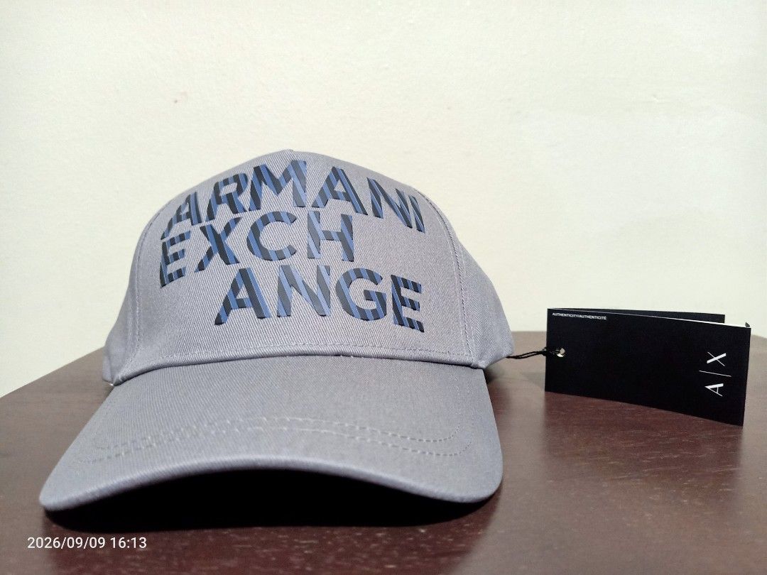 Armani Exchange AX Cap /Hat (Category: Caps & Hats) located in Las Pinas. Submitted by OmengSoyT (Listing ID 1463647915, Image 1). Description: - Authentic Armani Exchange cap -Grey color - Features iconic AX logo on the front - Adjustable rubber velcro strap for a custom fit - Comes with original hang and washed tags -One size fits all - Ideal for casual and everyday wear.