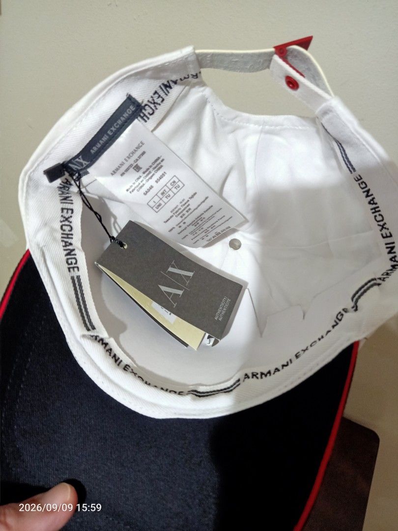 Armani Exchange AX White Black Baseball Cap Hat (Category: Caps & Hats) located in Las Pinas. Submitted by OmengSoyT (Listing ID 1463646342, Image 3). Description: - Authentic White Armani Exchange cap - Black brim with red trim - Large black 'ARMANI' lettering on front - 'EXCHANGE' lettering on back - Adjustable strap for a comfortable fit /OSFA - Brand new with original wash and hang tags attached - Perfect for casual wear.