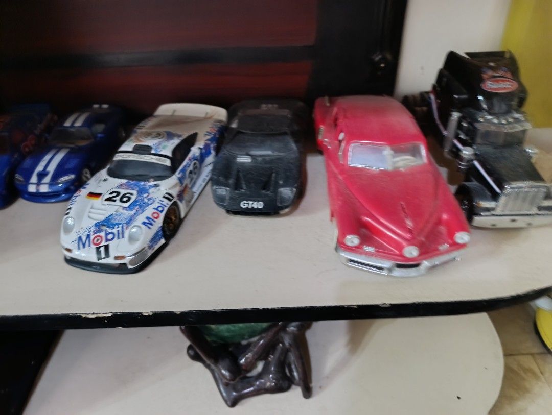 Assorted Diecast Toy Cars - Various Models (Category: Vehicle & Diecast Models) located in Quezon City. Submitted by kuruma_13 (Listing ID 1463653766, Image 1). Description: - Collection of diecast toy cars - Includes: Porsche GT1, Ford GT40, Chevrolet Bel Air, classic red hot rod, Peterbilt truck, and motorcycle - Perfect for display or play - Shows some wear and tear due to age - Selling as a complete lot.