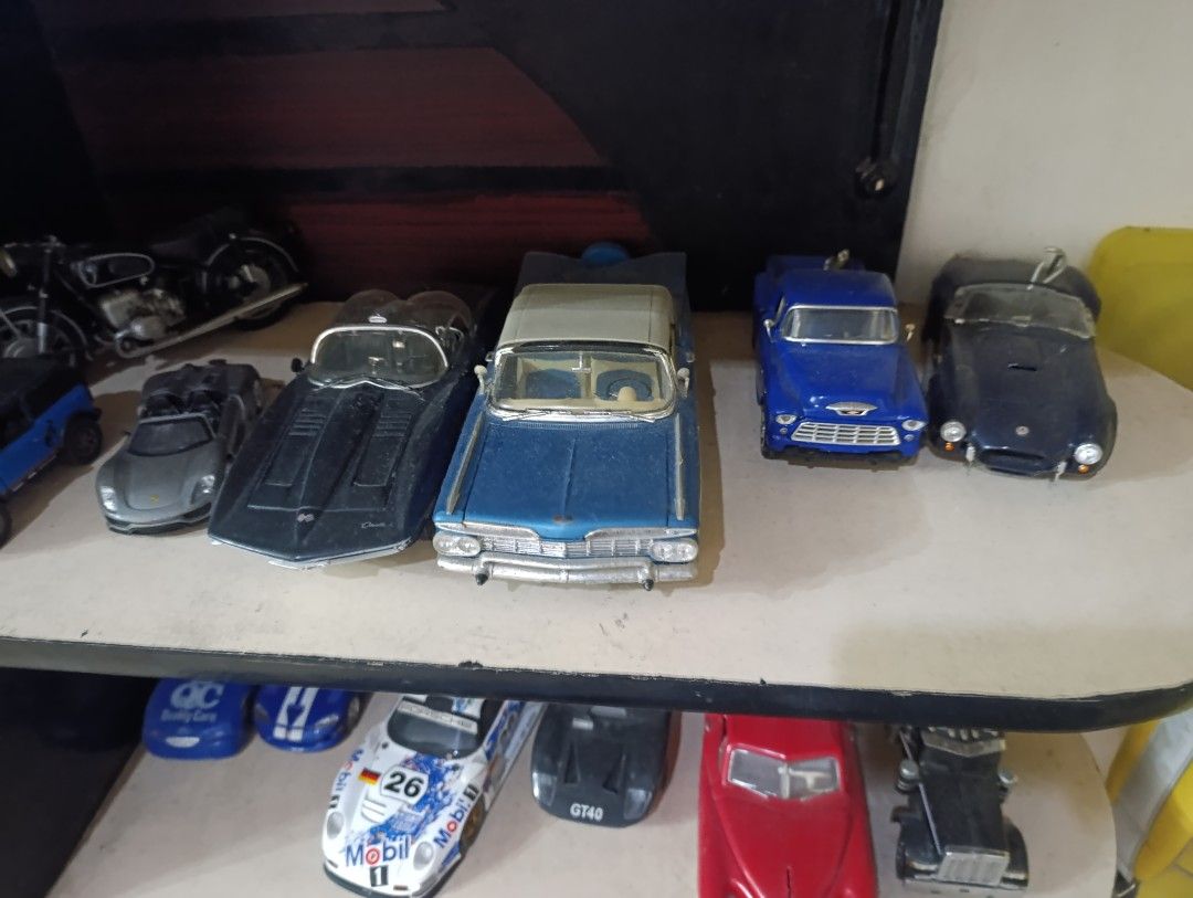 Assorted Diecast Toy Cars - Various Models (Category: Vehicle & Diecast Models) located in Quezon City. Submitted by kuruma_13 (Listing ID 1463653766, Image 2). Description: - Collection of diecast toy cars - Includes: Porsche GT1, Ford GT40, Chevrolet Bel Air, classic red hot rod, Peterbilt truck, and motorcycle - Perfect for display or play - Shows some wear and tear due to age - Selling as a complete lot.