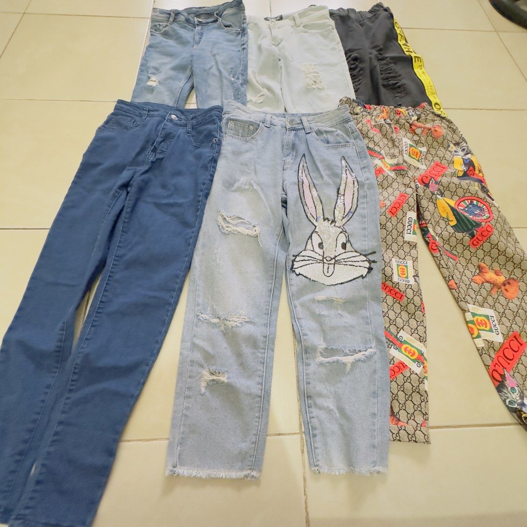 Assorted Ripped Jeans Bundle (Category: Jeans) located in Manila. Submitted by jessarodri89631 (Listing ID 1463606694, Image 2). Description: - Bundle of 6 pairs of jeans - Includes light wash, dark wash, and black denim - Features unique designs: Bugs Bunny, Gucci-inspired prints, and more - Perfect for casual wear and versatile styling - All jeans are in good, pre-loved condition.