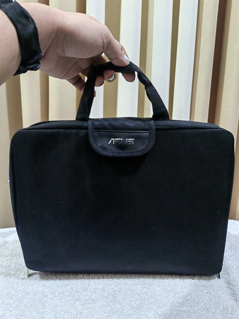ASUS Black Laptop sleeve/Bag (Category: Laptop Bags & Sleeves) located in Makati City. Submitted by prelovedtreatedwithlove (Listing ID 1463738898, Image 3). Description: - Black ASUS laptop or tablet bag - Comfortable carrying handle - Dedicated tablet compartment - Internal pocket for accessories - Secure zip-around closure - Excellent protection for your device on the go - Fits 11 inches, convertible to sleeve or carry on - Makapal high qualit