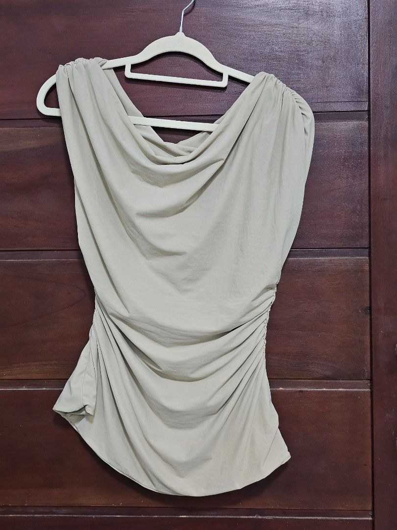 Asymmetrical Off-the-Shoulder top (Category: Blouses) located in Los Banos. Submitted by itsmecathey (Listing ID 1463709562, Image 2). Description: Bought it sa tiktok. Never worn kasi malaki saken :( Free size siya. Pero the top can fit to M-L.