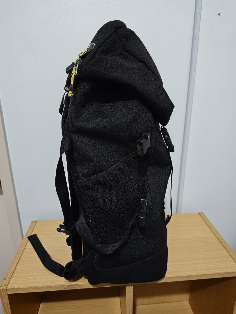 ATHLETA Black Backpack (Category: Backpacks) located in Manila. Submitted by liamsureplus.1995 (Listing ID 1463614723, Image 2). Description: - Black Athleta backpack - Features iconic Athleta logo with three stars on the front flap - Zippered pocket on the front for secure storage - Convenient side mesh pockets for water bottles or essentials - Adjustable straps for a comfortable fit - Ideal for everyday use, school, or travel adventures.