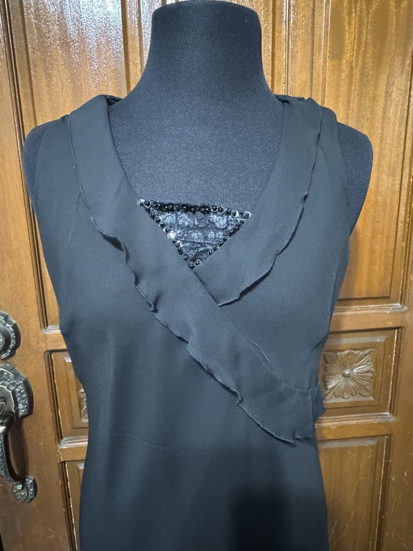 Atmosphere Black Sleeveless Midi Dress (Category: Dresses) located in Manila. Submitted by prelovedshopmnl (Listing ID 1463635917, Image 2). Description: - Black sleeveless midi dress by Atmosphere - Features a ruffled neckline - Sequined detail at the bust - Ruffled hemline - Ideal for parties or a night out - Size 16 on tag but fits Medium frame.