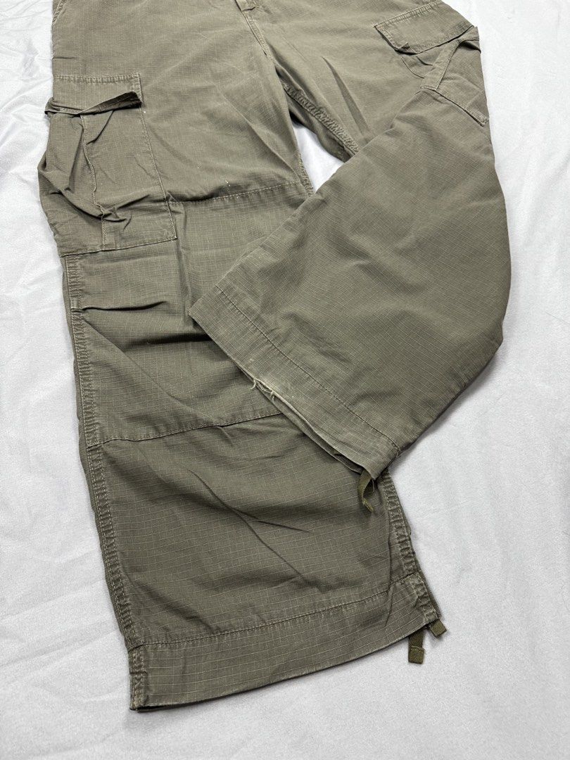 AUTHENTIC CARHARRT RIPSTOP CARGO PANTS / OLIVE GREEN (Category: Jeans) located in Santa Rosa. Submitted by sunflora.ph (Listing ID 1463597235, Image 2). Description: 🪎💎Authentic Carhartt Ripstop Cargo Pants / Olive Green (Utility / Techwear Vibe)💎🪎 •High-demand military-utility wear. •Crafted from durable cotton ripstop fabric with adjustable drawstrings at the hem so you can style them loose or cinched. •Details: Iconic Carhartt square woven