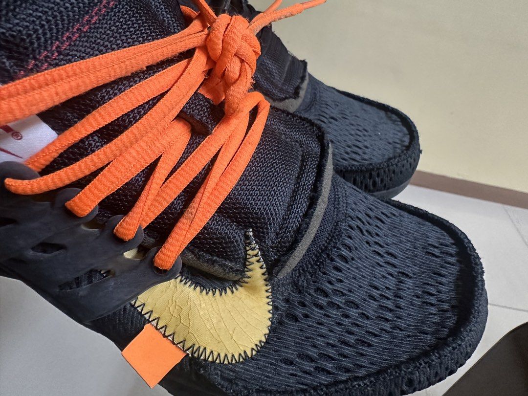 AUTHENTIC Nike Off-White Air Presto (Category: Sneakers) located in Sariaya. Submitted by ja0111 (Listing ID 1463659922, Image 3). Description: - Black Nike Air Presto sneakers - Vibrant orange and black laces only, no box - Iconic "AIR" text on heel strap - Does not Include Off-White zip tie - Yellow swoosh detail on the side - Ideal for everyday casual wear - Bought 45k last 2022 - selling low di na nagamit - u can legit check.