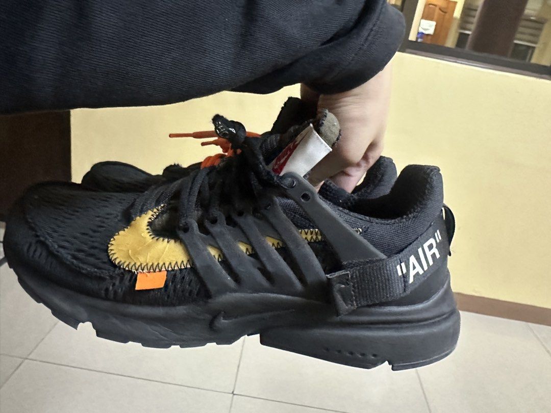 AUTHENTIC Nike Off-White Air Presto (Category: Sneakers) located in Sariaya. Submitted by ja0111 (Listing ID 1463659922, Image 2). Description: - Black Nike Air Presto sneakers - Vibrant orange and black laces only, no box - Iconic "AIR" text on heel strap - Does not Include Off-White zip tie - Yellow swoosh detail on the side - Ideal for everyday casual wear - Bought 45k last 2022 - selling low di na nagamit - u can legit check.