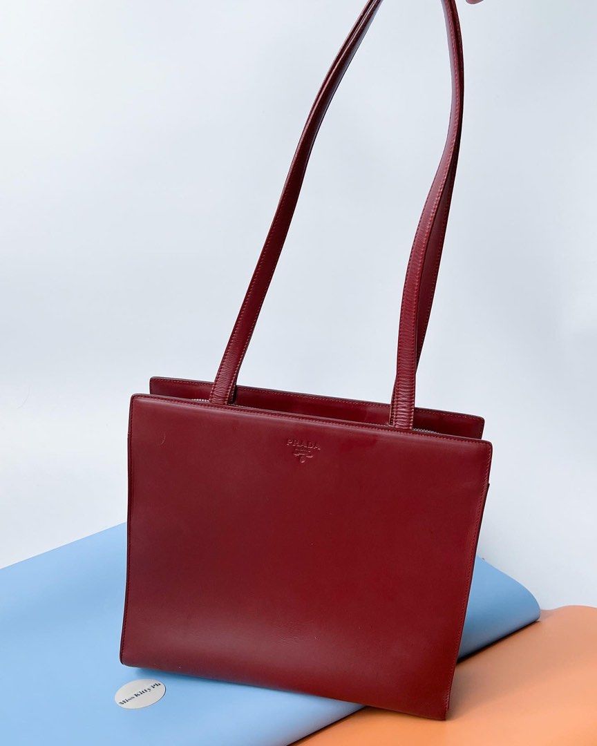 Authentic Preloved Prada Vintage Bordeaux long shoulder bag (Category: Luxury Bags & Wallets) located in San Pablo. Submitted by misskittyph (Listing ID 1463583882, Image 2). Description: Prada Bordeaux Burgundy Medium Leather Long Shoulder Bag ▪️21500 only 8.5/10 condition Tolerable corner rubs Dimension is L27 x H24 x W9 (cm) generic dustbag Layaway options available 💯Guaranteed authentic or your money back ‼️NO IG DMs pls ‼️ Contact details i