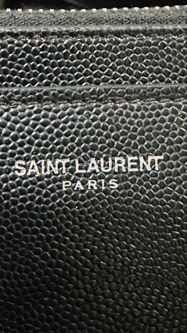 Authentic YSL Grain Leather Pouch (Category: Luxury Bags & Wallets) located in Las Pinas. Submitted by marshmallowmax (Listing ID 1463604890, Image 2). Description: Guaranteed Authentic! Like new or 9/0 condition. L-8 x H-4.5” With dustbag and cards.