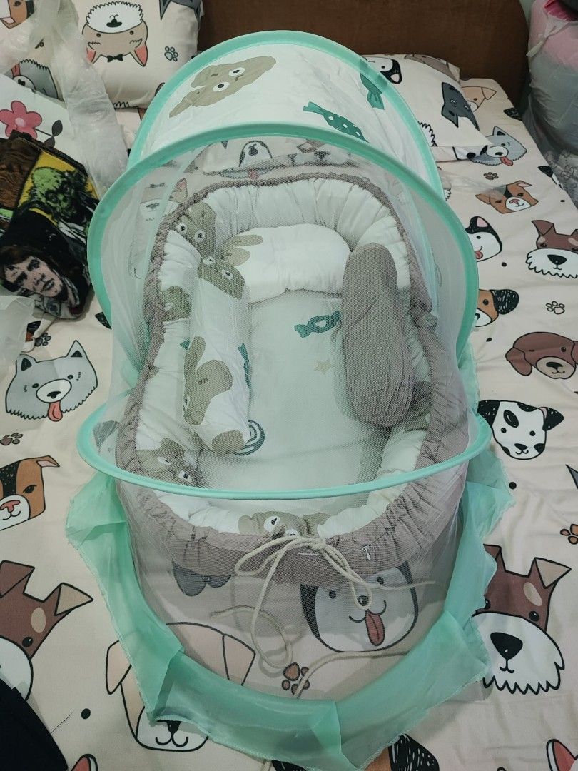 Baby Bed With Mosquito Net (Category: Other Kids Furniture) located in Tarlac. Submitted by camssyyyyy (Listing ID 1463605499, Image 2). Description: Baby Bed with Mosquito Net - outside length 85 cm - inside length 68 cm - outside width 55 cm - inside width 30 cm Suitable for children 0-3 years old Pm for more details. Thankyou!.