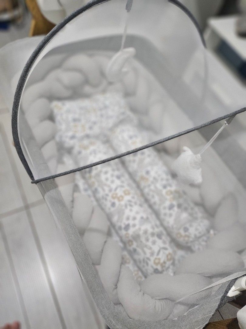 Baby Nest Bed with Mosquito Net (Category: Cots & Cribs) located in Cavite. Submitted by great_stuffsph (Listing ID 1463603531, Image 2). Description: Selling Akeeva swinging bassinet.-7500 Free Basinet foam(bought separately. comforter set with free braid bumper- 950 PM for interested - Portable baby nest bed for comfortable naps and travel. - Comes with a detachable mosquito net to protect your baby. - Padded sides ensure a safe and cozy enviro