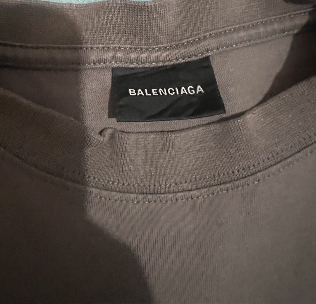 Balenciaga Logo T-Shirt (Category: Shirts) located in Quezon City. Submitted by fly29 (Listing ID 1463684459, Image 2). Description: - Balenciaga Grey T-shirt - Size: XS (can fit L female and small to medium male) - Features classic Balenciaga logo on both front and back - Made in Portugal - Perfect for everyday casual style.