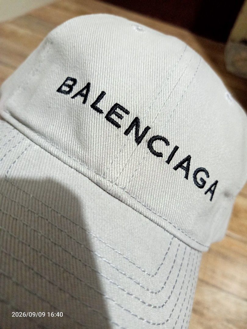 Balenciaga Paris Cap (Category: Caps & Hats) located in Las Pinas. Submitted by OmengSoyT (Listing ID 1463649632, Image 1). Description: - Authentic Balenciaga cap - Color grey, 100% Cotton - One size fits all. Adjustable velcro strap - Features embroidered Balenciaga Paris logo on the front - Made in Italy - Comes with hang and washed tags - Ideal for everyday wear.