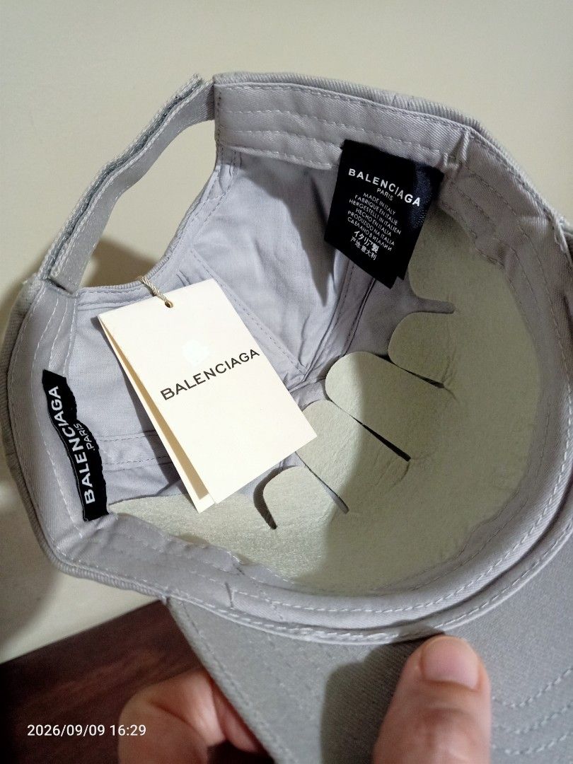 Balenciaga Paris Cap (Category: Caps & Hats) located in Las Pinas. Submitted by OmengSoyT (Listing ID 1463649632, Image 3). Description: - Authentic Balenciaga cap - Color grey, 100% Cotton - One size fits all. Adjustable velcro strap - Features embroidered Balenciaga Paris logo on the front - Made in Italy - Comes with hang and washed tags - Ideal for everyday wear.