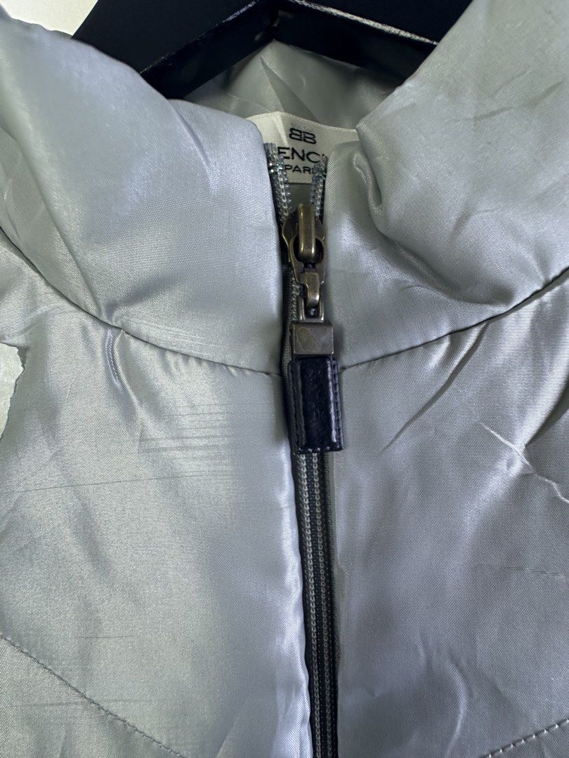 Balenciaga Puffer Vest (Category: Vests) located in Manila. Submitted by declutterpromax (Listing ID 1463607860, Image 3). Description: - Balenciaga puffer vest - Color: Light Grey - Size: M - Features: Zip-up front, stand-up collar - Ideal for: Layering in cooler weather - Note: Check label detail.