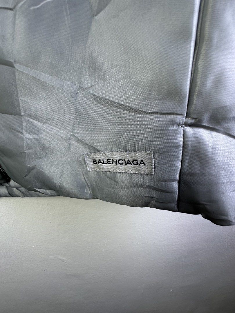 Balenciaga Puffer Vest (Category: Vests) located in Manila. Submitted by declutterpromax (Listing ID 1463607860, Image 2). Description: - Balenciaga puffer vest - Color: Light Grey - Size: M - Features: Zip-up front, stand-up collar - Ideal for: Layering in cooler weather - Note: Check label detail.
