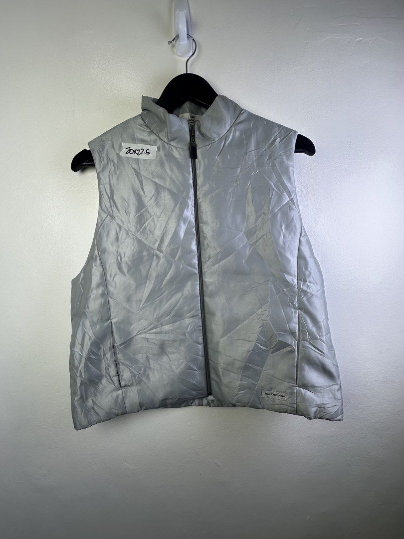 Balenciaga Puffer Vest (Category: Vests) located in Manila. Submitted by declutterpromax (Listing ID 1463607860, Image 1). Description: - Balenciaga puffer vest - Color: Light Grey - Size: M - Features: Zip-up front, stand-up collar - Ideal for: Layering in cooler weather - Note: Check label detail.