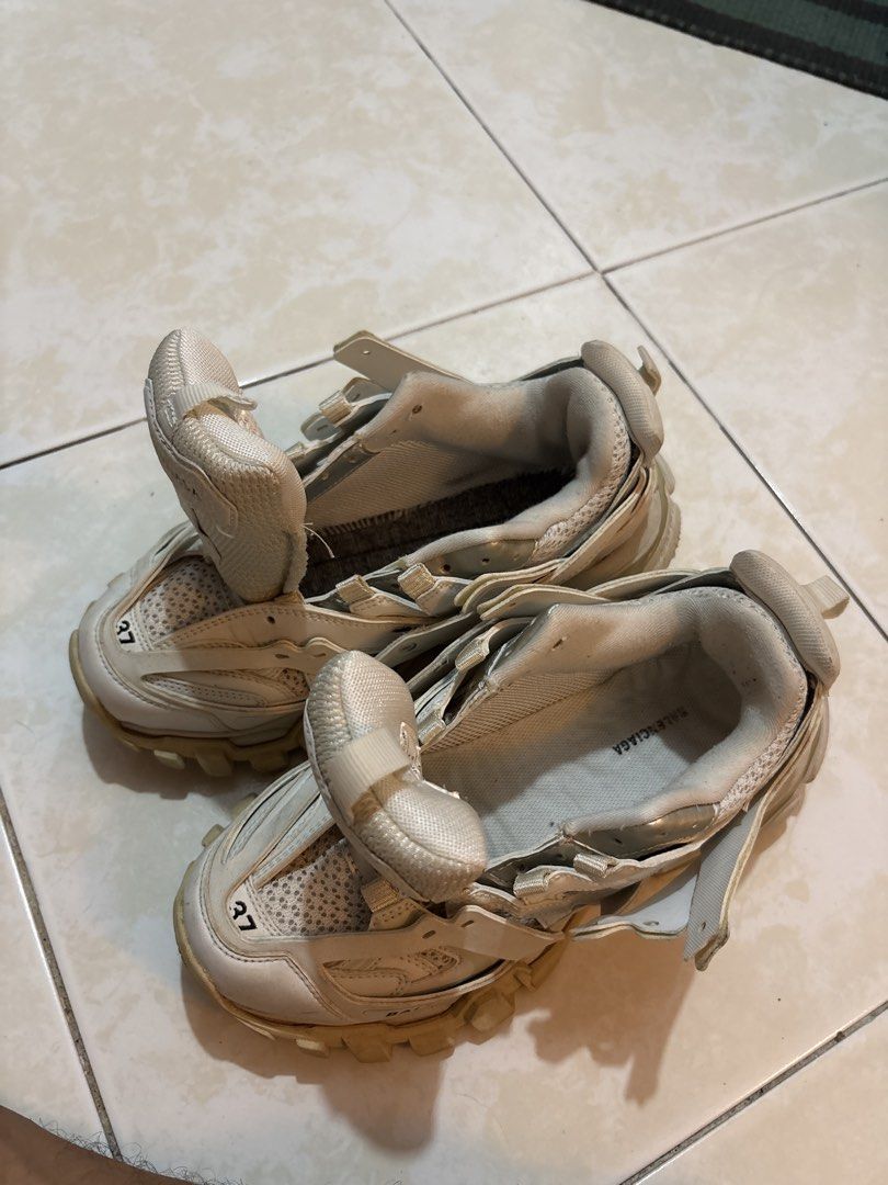 Balenciaga Track Sneakers Size 37 (Category: Sneakers) located in Quezon City. Submitted by shndm25 (Listing ID 1463707843, Image 3). Description: - Brand: Balenciaga - Model: Track Sneakers - Size: 37 - Color: Cream/Off-White - Style: Chunky Track - Condition: Missing right sole padding, and missing shoelaces. Can be replaced. Over all, it’s a 8/10. .