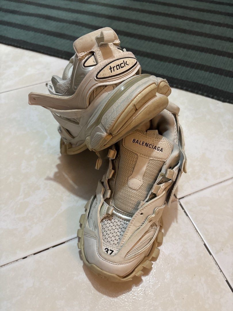 Balenciaga Track Sneakers Size 37 (Category: Sneakers) located in Quezon City. Submitted by shndm25 (Listing ID 1463707843, Image 2). Description: - Brand: Balenciaga - Model: Track Sneakers - Size: 37 - Color: Cream/Off-White - Style: Chunky Track - Condition: Missing right sole padding, and missing shoelaces. Can be replaced. Over all, it’s a 8/10. .