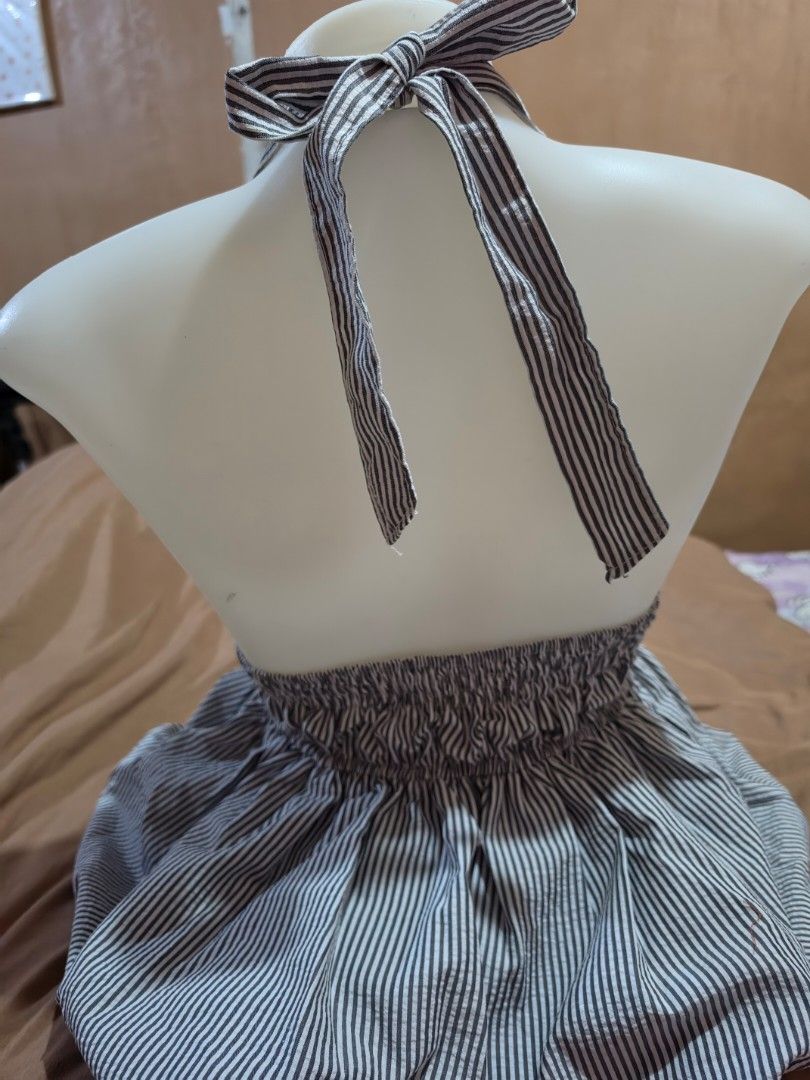 Balloon Halter Top (Category: Blouses) located in Malabon City. Submitted by lpzangie (Listing ID 1463707291, Image 2). Description: - Cute striped halter neck dress - Subtle textured fabric - Ties at the back with a bow - Gathered skirt with a full, flowy look - Ideal for casual days or beach trips - Easy to wear and style.