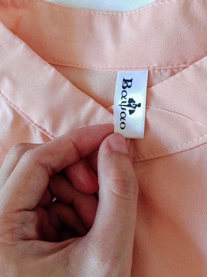 Bangkok Button Down Ruffle Long Dress (Category: Dresses) located in Legazpi City. Submitted by gellybean_closet (Listing ID 1463596509, Image 3). Description: 🎀 Item Details: • Price: ₱199.00 • Size: Fits Small to Medium • Condition: Pre-loved (Used but not abused) • Features: Full front button-down closure, tiered ruffle hem • Color: Peach (Note: Color may slightly vary due to lighting) 💰 Payment: Cash / GCash 📍 Meet-up: Every Saturday (With