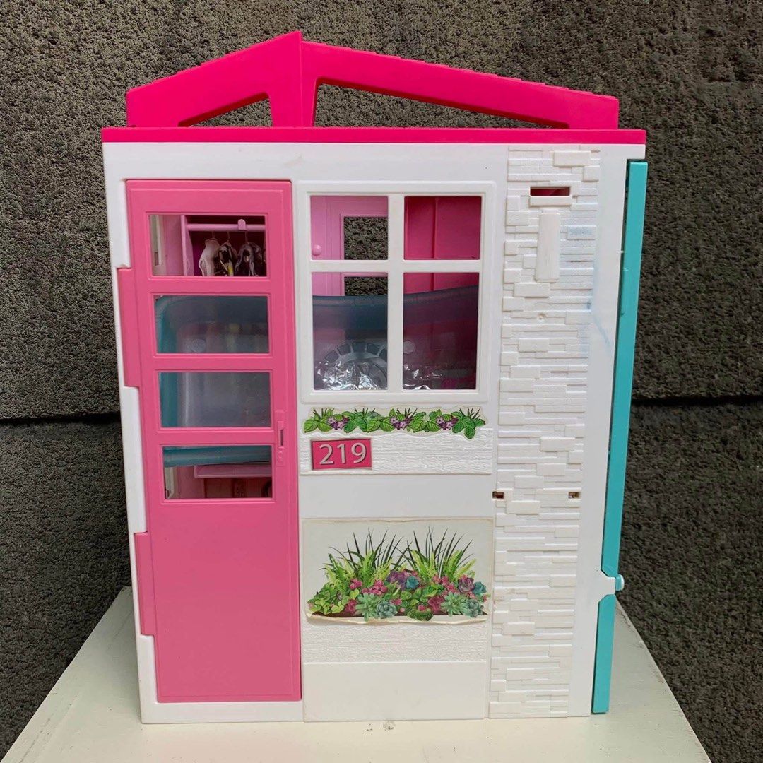 Barbie Dreamhouse Dollhouse Playset (Category: Kids Toys) located in Malabon City. Submitted by zyrhdls (Listing ID 1463664861, Image 1). Description: - Adorable Barbie house for endless fun - Features a charming pink door and windows - Includes a fun grill and outdoor seating area - Comes with a cute small orange tree - Ideal for sparking imaginative play - Ready to find its new loving home.