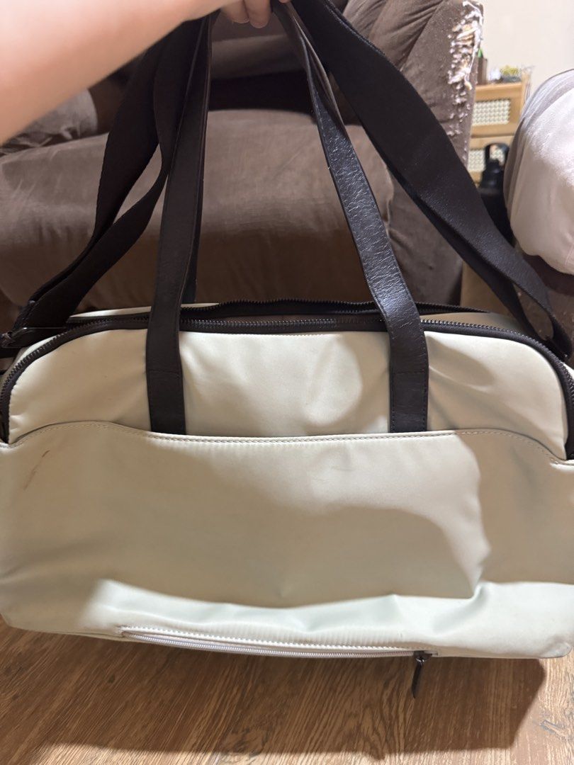 BASH Duffel Bag (Category: Sling Bags) located in Las Pinas. Submitted by anjpgarcia (Listing ID 1463675194, Image 3). Description: - 1 light green colored duffel bag - 1 cream colored duffel bag - Black straps - Front pocket for easy access - Zippered compartment for secure storage - Embossed BASH logo on the front - Ideal size for weekend getaways or gym sessions - Smooth working zippers - Clean interior and exterior.
