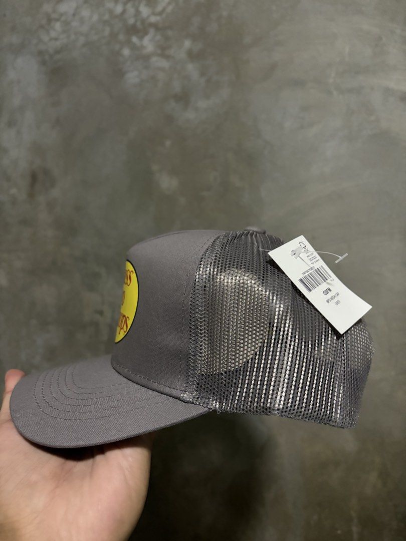 Bass Pro Shops Mesh Trucker Cap Grey OSFM (Category: Caps & Hats) located in Guihulngan. Submitted by fbthriftgoodsniace (Listing ID 1463613672, Image 2). Description: - Grey Bass Pro Shops trucker cap - Features iconic Bass Pro Shops logo with fish graphic - Breathable mesh back - Adjustable snapback closure for a custom fit - One Size Fits Most (OSFM) - Ideal for fishing adventures or everyday casual style.